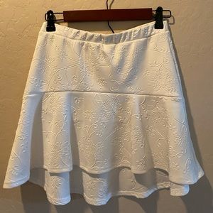 High-low skirt with intricate detailing